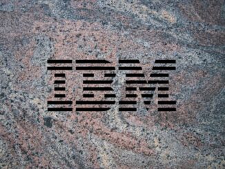 IBM logo on a granite background to illustrate the launch of the company's Granite 3.0 family of AI models alongside an open-source commitment.